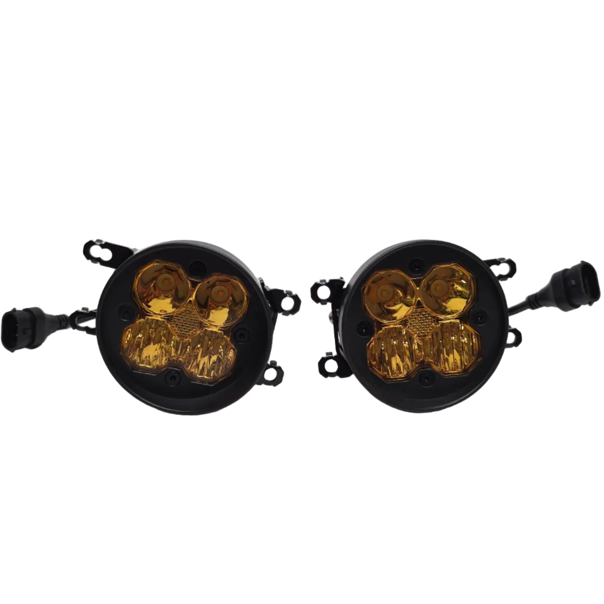 A pair of round black automotive signal lights with amber lenses, shown on a light gray studio background.